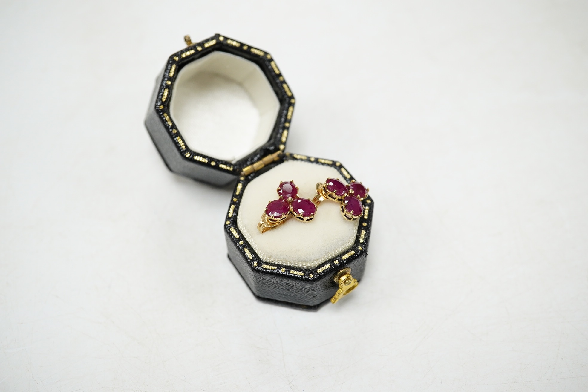 A modern pair of 9ct gold and three stone ruby cluster set ear studs, 9mm, gross weight 1.6 grams. Condition - good